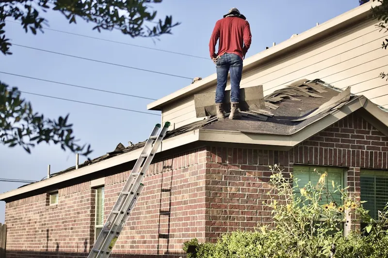Professional roofer working on a residential roof in Napa